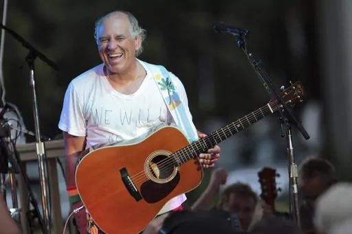 Jimmy Buffett performs at his sister's restaurant in Gulf Shores, Ala., on June 30, 2010. “Margaritaville” singer-songwriter Jimmy Buffett has died at age 76. A statement on Buffett's official website and social media pages says the singer died Friday, Sept. 1, 2023 “surrounded by his family, friends, music and dogs”. (AP Photo/Dave Martin, File)