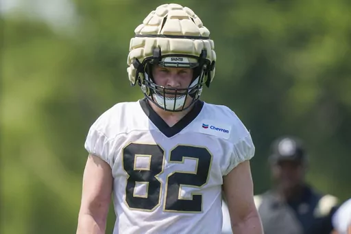 New Orleans Saints tight end Foster Moreau walks between drills during NFL football practice in Metairie, La., May 23, 2023. Moreau says he is in “full remission” from cancer that team doctors discovered in late March. The 26-year-old Moreau says in a social media post that his “prayers were answered” and that he's “so grateful to everyone who reached out to offer their love and support." (AP Photo/Gerald Herbert, File)