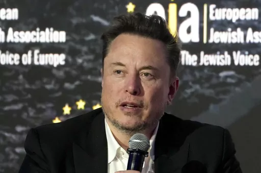 Tesla and SpaceX's CEO Elon Musk addresses the European Jewish Association's conference, in Krakow, Poland, Monday, Jan. 22, 2024. A group of federal appeals court judges in New Orleans is deciding whether a 2018 Twitter post by Tesla CEO Elon Musk unlawfully threatened Tesla employees with the loss of stock options if they decided to be represented by a union. (AP Photo/Czarek Sokolowski, File)