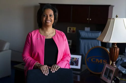 Chiquita Brooks-LaSure, the Administrator for the Centers of Medicare and Medicaid Services, poses for a photograph in her office, Feb. 9, 2022, in Washington. The federal government is cracking down on nursing homes' abuse of antipsychotic drugs after an investigation in 2022 revealed an overwhelming majority of their residents are prescribed the medication. The Centers for Medicaid and Medicare Services will begin sending investigators to certain facilities in January 2023 to audit nursing hom