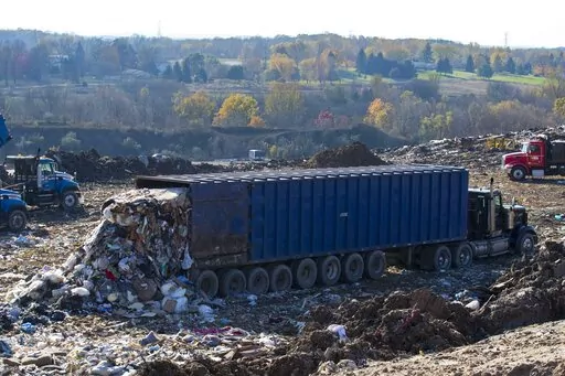 A truck drops off a load of garbage at the South Kent Landfill in Byron Township, Mich., on Wednesday, Nov. 8, 2017. On Thursday, April 7, 2022, the National Oceanic and Atmospheric Administration released a study calculating that levels of the potent heat-trapping gas methane rose at a record pace in 2021. Methane comes from energy use, agriculture and landfills and is also natural. (Mike Clark/The Grand Rapids Press via AP, File)