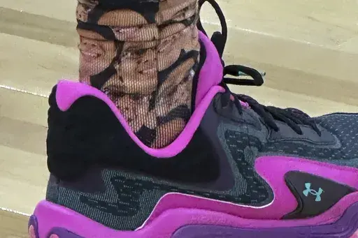 McNeese State guard Sincere Parker wears socks featuring team student manager Amir Khan during the first half in the first round of the NCAA college basketball tournament, Thursday, March 20, 2025, in Providence, R.I. (AP Photo/Jimmy Golen)