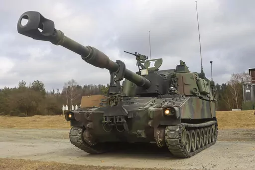 In this image provided by the U.S. Army, U.S. Soldiers from Battery A, 41st Field Artillery Regiment, 1st Armored Brigade Combat Team, 3rd Infantry Division, conduct live-fire exercises using the M109 Paladins at the Grafenwoehr Training Area, March 14, 2022. The first class of 635 Ukrainian fighters has finished a five-week advanced U.S. training course in Germany on sophisticated combat skills and armored vehicles, including M109 Paladins, that will be critical in the coming spring offensive a