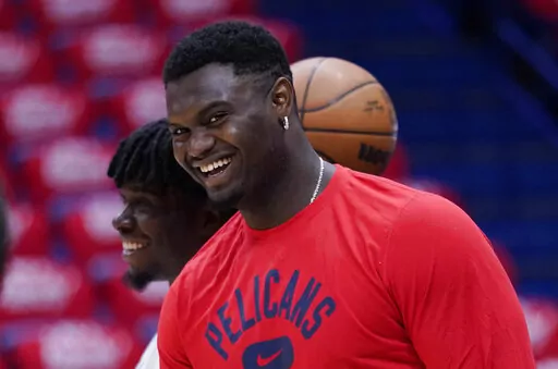 New Orleans Pelicans forward Zion Williamson watches a shoot-around before Game 6 of the team's NBA basketball first-round playoff series against the Phoenix Suns, April 29, 2022, in New Orleans. Two people familiar with the decision say Williamson has agreed to a five-year extension worth $193 million. The people spoke to The Associated Press on condition of anonymity because NBA rules do not allow the extension to become official until July 6. (AP Photo/Gerald Herbert, File)