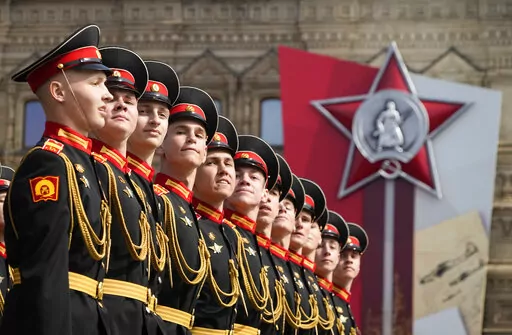Russian servicemen march during a dress rehearsal for the Victory Day military parade in Moscow, Russia, Saturday, May 7, 2022. The parade will take place at Moscow's Red Square on May 9 to celebrate 77 years of the victory in WWII. (AP Photo/Alexander Zemlianichenko)