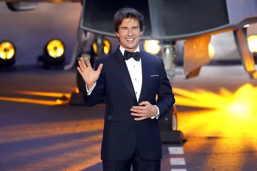 Tom Cruise poses for the media during the 'Top Gun Maverick' UK premiere at a central London cinema, on Thursday, May 19, 2022. (AP Photo/Alberto Pezzali)