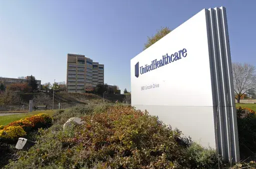 A sign stands on UnitedHealth Group Inc.'s campus in Minnetonka, Minn., Oct. 16, 2012. (AP Photo/Jim Mone, File)