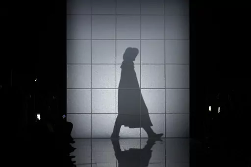 A model wears a creation as part of the Giorgio Armani women's Fall-Winter 2024-25 collection presented in Milan, Italy, Sunday, Feb. 25, 2024. (AP Photo/Luca Bruno)