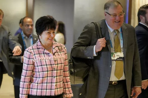 New Orleans Saints owner Gayle Benson, left, walks with the team's president Dennis Lauscha, right, at the NFL football owners spring meetings Wednesday, May 22, 2024, in Nashville, Tenn. (AP Photo/George Walker IV)