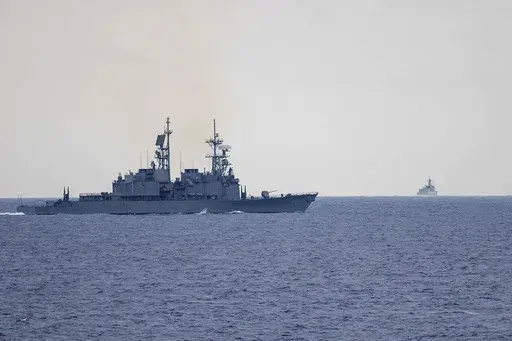 In this photo released by the Taiwan Ministry of National Defense, Taiwan guided missile destroyer Ma Kong DDG1805, left, monitors Chinese guided missile destroyer Xi'an DDG15, right, near Taiwan on Thursday, May 23, 2024. Taiwan tracked dozens of Chinese warplanes and navy vessels off its coast Friday on the second day of a large exercise China's People's Liberation Army held in response to the inauguration of the island's new leadership. (Taiwan Ministry of National Defense via AP)