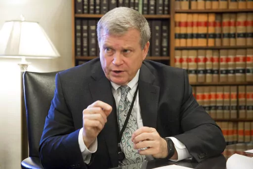 In this March 1, 2017, file photo, Idaho Attorney General Lawrence Wasden speaks during an interview in Boise, Idaho. The false claims that the 2020 election was stolen from former President Donald Trump and protecting future election results loom large over this year’s races for state attorneys general. Candidates who support Trump’s position are angling to unseat Democratic incumbents in political swing states – and in some cases, knock out moderate attorneys general in GOP primaries. (D