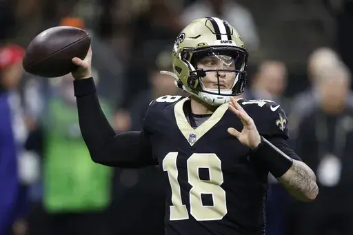 New Orleans Saints quarterback Spencer Rattler (18) throws a pass in the second half of an NFL football game against the Washington Commanders in New Orleans, Sunday, Dec. 15, 2024. (AP Photo/Butch Dill)