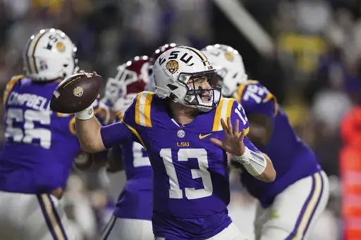 LSU quarterback Garrett Nussmeier (13) passes in the first half an NCAA college football game against Oklahoma in Baton Rouge, La., Saturday, Nov. 30, 2024. (AP Photo/Gerald Herbert)