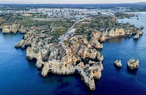 Water surrounds the coast of Cabo da Roca near Lisbon, Portugal, Friday, April 14, 2023. (AP Photo/Michael Probst)
