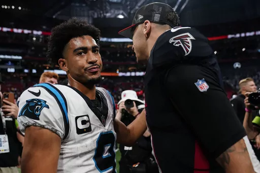 Carolina Panthers quarterback Bryce Young (9) speaks with Atlanta Falcons quarterback Desmond Ridder (9) after an NFL football game, Sunday, Sept. 10, 2023, in Atlanta. The Atlanta Falcons won 24-10. (AP Photo/Brynn Anderson)
