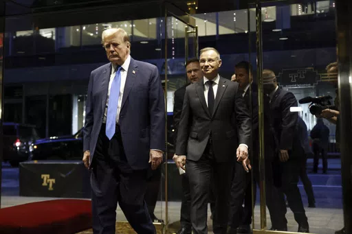Republican presidential candidate former President Donald Trump walks with Poland's President Andrzej Duda at Trump Tower in midtown Manhattan in New York on Wednesday, April 17, 2024. (AP Photo/Stefan Jeremiah)