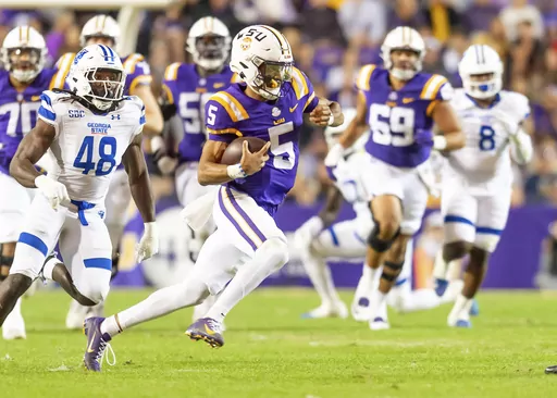 LSU quarterback Jayden Daniels (5) runs the ball against Georgia State during an NCAA college football game in Baton Rouge, La., Saturday, Nov. 18, 2023. (Scott Clause/The Daily Advertiser via AP)