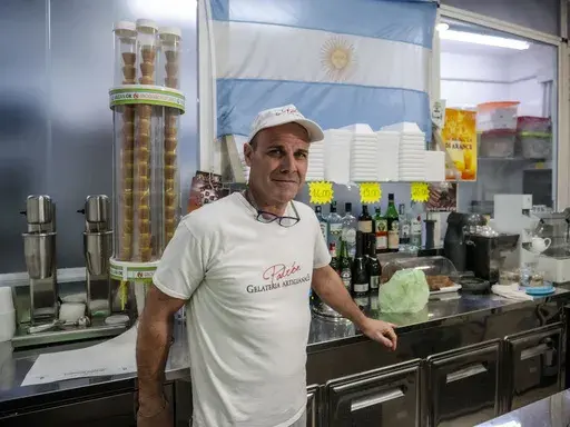 Sebastian Padrón, from La Plata, Argentina, poses in his ice cream in Rome, Tuesday, Feb. 25, 2025. (AP Photo/Paolo Santalucia)