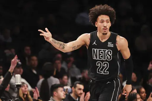 Brooklyn Nets forward Jalen Wilson (22) gestures after making a three-point basket during the first half of an NBA basketball game against the New Orleans Pelicans, Tuesday, April 8, 2025, in New York. (AP Photo/Heather Khalifa)