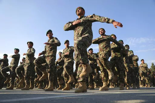 Newly graduated Afghan National Army personnel march during their graduation ceremony after a three month training program at the Afghan Military Academy in Kabul, Afghanistan on Nov. 29, 2020. U.N. Secretary-General Antonio Guterres said in a report obtained Sunday, Jan. 30, 2022, by The Associated Press, the world body has received “credible allegations” that more than 100 former members of the Afghan government, its security forces and those who worked with international troops have been 