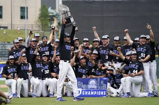 Duke coach Chris Pollard holds the trophy after a win overt North Carolina State in an NCAA college baseball game during the Atlantic Coast Conference championship game on Sunday, May 30, 2021, in Charlotte, N.C. Duke moved into the top 10 of the national rankings Monday, March 11, 2024, after winning two of three on the road against Wake Forest, which had opened the season No. 1 in the major polls. (AP Photo/Chris Carlson, File)