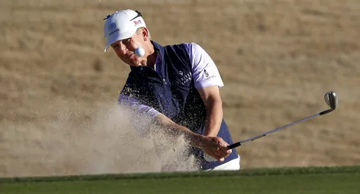 David Toms hits out of a bunker on the 18th hole during the second round of PGA Tour Champions' Cologuard Classic golf tournament in Tucson, Ariz., Saturday, March 4, 2023. (Kelly Presnell/Arizona Daily Star via AP)