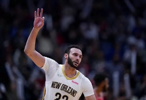 New Orleans Pelicans forward Larry Nance Jr. (22) celebrates after scoring a basket during the second half of the team's NBA basketball game against the Chicago Bulls in New Orleans, March 24, 2022. The agent for Nance says his client has agreed to a two-year extension worth $21.6 million. Mark Bartelstein says the agreement runs through the 2024-25 season. (AP Photo/Gerald Herbert, File)