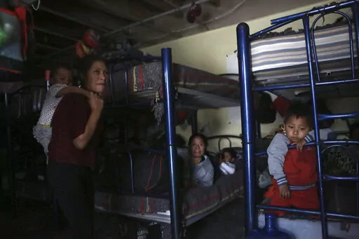 Migrants rest in a dormitory of the Good Samaritan shelter in Juarez, Mexico, March 29, 2022. The vast majority of people staying at the shelter are women and their children from Mexico and Central America who have been expelled under Title 42 authority or were still waiting to try for asylum, according to Pastor Juan Fierro, the shelter's director. (AP Photo/Christian Chavez, File)