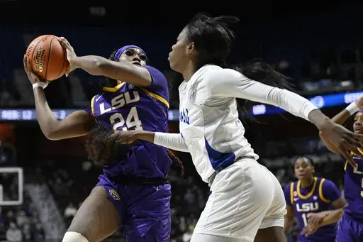 LSU guard Aneesah Morrow (24) grabs a rebound against Seton Hall forward I'yanna Lops in the first half of an NCAA college basketball game, Tuesday, Dec. 17, 2024, in Uncasville, Conn. (AP Photo/Jessica Hill)