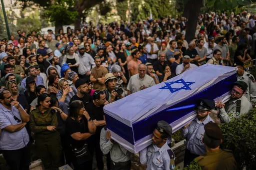 Israeli soldiers carry the flag-covered coffin of Shilo Rauchberger at the Mount Herzl cemetery in Jerusalem, Thursday, Oct. 12, 2023. In Israel on Saturday, rabbis worked around the clock at Shura military base in Israel to identify and count the dead civilians and soldiers gunned down in the Hamas attack last week. Israel's military rabbinate is working on Shabbat for the first time since 2005. Some of the bodies have been brought to Mount Herzl, Israel's national cemetery in Jerusalem. (AP Ph