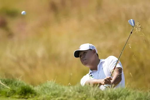 Si Woo Kim hits from the rough on the eighth hole during the second round of the U.S. Open golf tournament at Los Angeles Country Club on Friday, June 16, 2023, in Los Angeles. (AP Photo/Marcio J. Sanchez)
