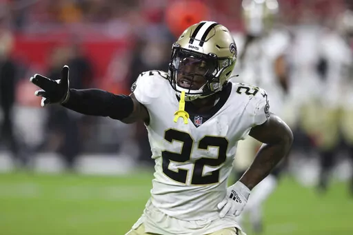 New Orleans Saints defensive back C.J. Gardner-Johnson (22) reacts to a stop against the Tampa Bay Buccaneers during the second half of an NFL football game Sunday, Dec. 19, 2021, in Tampa, Fla. The Philadelphia Eagles acquired defensive back C.J. Gardner-Johnson in a trade Tuesday, Aug. 30, 2022, with New Orleans that removes a popular and productive play-maker from the Saints' secondary.(AP Photo/Mark LoMoglio, File)