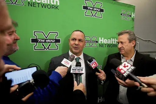 Marshall University's head football coach Tony Gibson responds to questions during a press conference on Thursday, Dec. 12, 2024, at the Brad D. Smith Center for Business and Innovation in Huntington, W.Va. (Ryan Fischer/The Herald-Dispatch via AP)