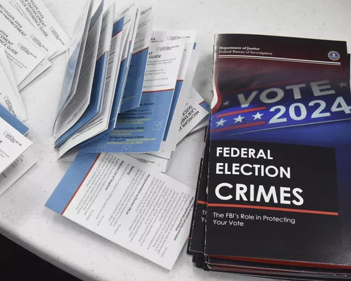 Educational materials provided by the Committee of Safe and Secure Elections are pictured at a conference with local election and law enforcement officials Wednesday, April 10, 2024, in Traverse City, Mich. A top concern for local election workers throughout the country this year is their own safety. The committee, formed after the 2020 presidential election, is traveling the country helping them prepare for what could lie ahead and making sure they are connected to local law enforcement. (AP Ph