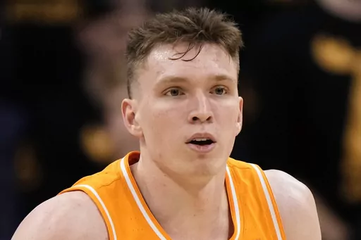Tennessee guard Dalton Knecht plays during the first half of an NCAA college basketball game against Missouri Tuesday, Feb. 20, 2024, in Columbia, Mo. Knecht is the AP All-SEC player of the year and newcomer of the year in balloting released Tuesday, March 12, 2024. (AP Photo/Charlie Riedel, File)