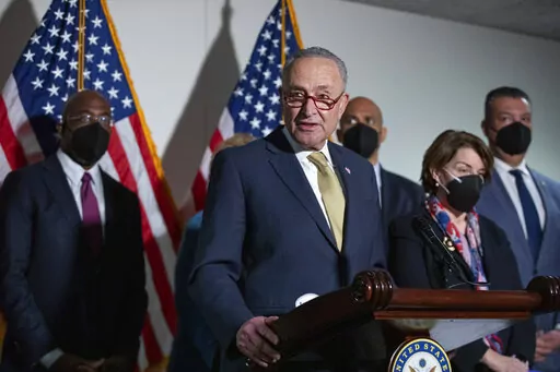 Senate Majority Leader Chuck Schumer, D-N.Y., speaks to reporters alongside, from left, Sen. Raphael Warnock, D-Ga., Sen. Cory Booker, D-N.J., Sen. Amy Klobuchar, D-Minn., and Sen. Alex Padilla, D-Calif., during a press conference regarding the Democratic party's shift to focus on voting rights at the Capitol in Washington, Tuesday, Jan. 18, 2022. (AP Photo/Amanda Andrade-Rhoades)