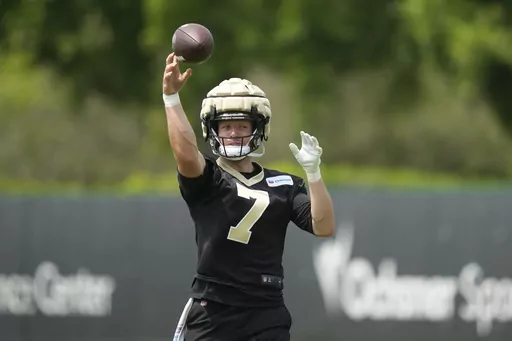 New Orleans Saints tight end Taysom Hill (7) runs through drills at the team's NFL football minicamp in Metairie, La., Thursday, June 15, 2023. (AP Photo/Gerald Herbert)