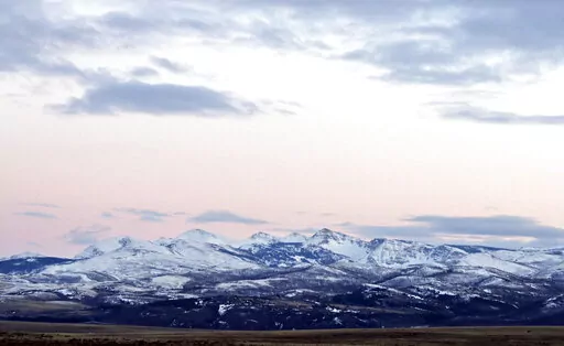 In this March 25, 2016, file photo, the sun sets over the Badger-Two Medicine area near Browning, Mont. The cultural leaders of the Blackfeet tribe filed an appeal Tuesday, Nov. 1, 2022, against a judge's recent order to reinstate an oil and gas lease that was first issued four decades ago in an area adjacent to Glacier National Park and the Blackfeet Reservation in Montana. The area is considered sacred to the Blackfeet. (Greg Lindstrom/Flathead Beacon via AP, File)