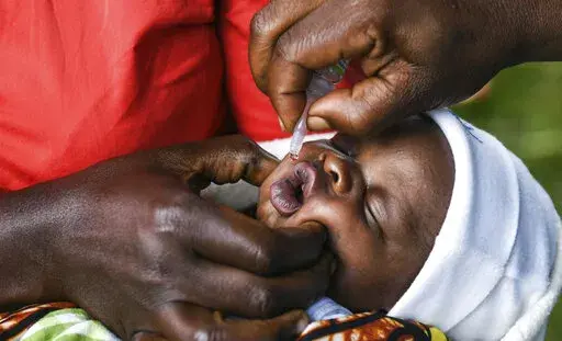 A baby receives a polio vaccine during the Malawi Polio Vaccination Campaign Launch in Lilongwe, Malawi, on March 20, 2022. In neighbouring Mozambique, health authorities declared Wednesday May 18, 2022, an outbreak of wild poliovirus after confirming that a child in the country's northeastern Tete province had contracted the disease. (AP Photo/Thoko Chikondi, File)