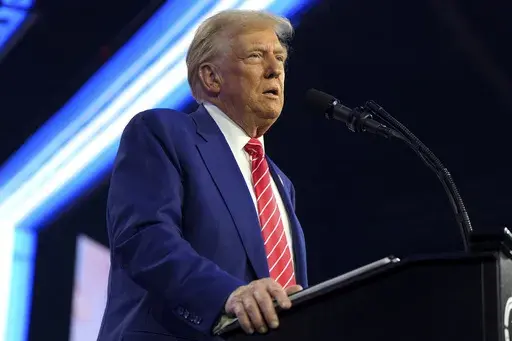 President-elect Donald Trump speaks at AmericaFest, Sunday, Dec. 22, 2024, in Phoenix. (AP Photo/Rick Scuteri)