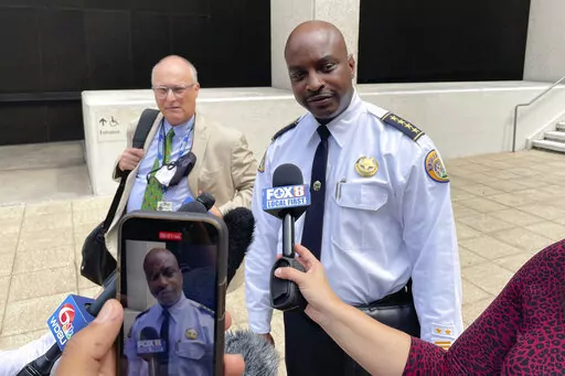 New Orleans Police Superintendent Shaun Ferguson talks to reporters outside the federal courthouse in New Orleans on Aug. 17, 2022. Hoping to beef up a dwindling police force amid a rise in violent crime, New Orleans officials announced a three-year $80 million plan Thursday, Sept. 8, 2022, offering raises for all officers, free health care and $30,000 in incentive payments for new hires. (AP Photo/Kevin McGill, File)