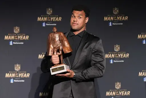 Jacksonville Jaguars defensive lineman Arik Armstead poses with his Walter Payton Man of the Year award at the NFL Honors award show ahead of the Super Bowl 59 football game, Thursday, Feb. 6, 2025, in New Orleans. (AP Photo/Gerald Herbert)