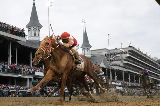 Rich Strike, with Sonny Leon aboard, crosses the finish line to win the 148th running of the Kentucky Derby horse race at Churchill Downs Saturday, May 7, 2022, in Louisville, Ky. Rich Strike's stunning upset victory in last year's Kentucky Derby as a nearly 81-1 long shot provided the race's second biggest odds winner in four years. (AP Photo/Jeff Roberson, File)