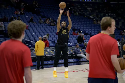 Cleveland Cavaliers guard Donovan Mitchell , who has missed seven games for bone bruise, warms up before an NBA basketball game against the New Orleans Pelicans in New Orleans, Wednesday, March 13, 2024. (AP Photo/Matthew Hinton)