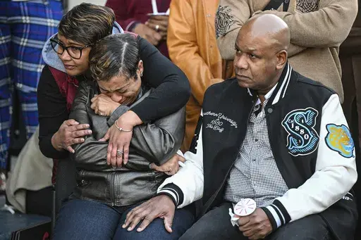 Father Corey Wilson, right, mourns alongside other grieving family members during a vigil for his son, Caleb Wilson, outside of Southern University's Smith-Brown Student Union on Wednesday, March 5, 2025, in Baton Rouge, La. (Javier Gallegos/The Advocate via AP)