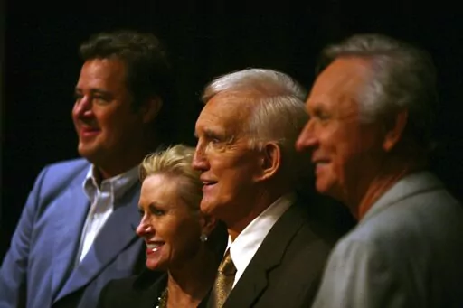 Tammy Genovese, second left, Country Music Association Chief Operating Officer, poses for a photo with Vince Gill, left, Ralph Emery and Mel Tillis, right, Tuesday, Aug. 7, 2007, in Nashville, Tenn., after it was announced that the three men will be inducted into the Country Music Hall of Fame. Emery, who became known as the dean of country music broadcasters over more than a half-century in both radio and television, died Saturday, Jan. 15, 2022, his family said. He was 88. (AP Photo/Jeff Adkin
