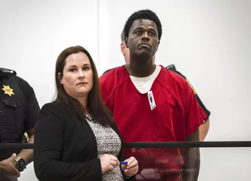 Wesley Brownlee stands with public defender Allison Nobert during his arraignment in San Joaquin County Superior Court on Tuesday, Oct. 18, 2022. Brownlee has been charged in four additional slayings this week, bringing his total to seven deaths in Northern California since April 2021, authorities said. (Hector Amezcua/The Sacramento Bee via AP,File)/The Sacramento Bee via AP, File)