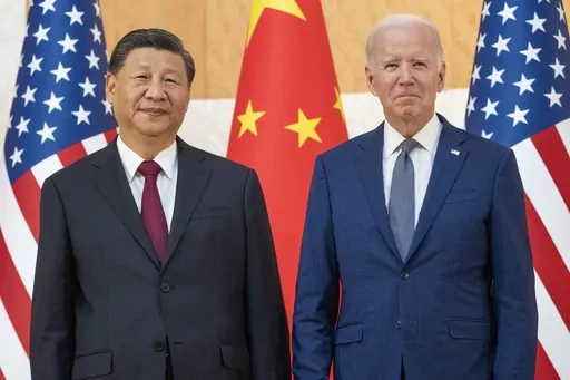 U.S. President Joe Biden, right, stands with Chinese President Xi Jinping before a meeting on the sidelines of the G20 summit on Nov. 14, 2022, in Bali, Indonesia. When Washington and Beijing do economic battle – as they have for five years now – the rest of the world suffers, too. And when they hold a top-level summit – as Biden and Xi will this week – the rest of the world pays attention. (AP Photo/Alex Brandon, File)