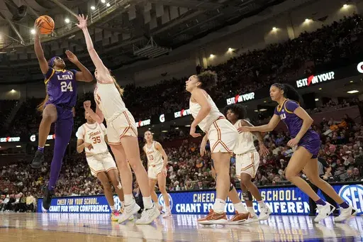 LSU guard Aneesah Morrow shoots over Texas forward Taylor Jones during the first half during of an NCAA college basketball game in the semifinals of the Southeastern Conference tournament, Saturday, March 8, 2025, in Greenville, S.C. (AP Photo/Chris Carlson)