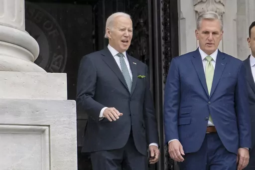 President Joe Biden talks with House Speaker Kevin McCarthy, R-Calif., as he departs the Capitol following the annual St. Patrick's Day gathering, in Washington, March 17, 2023. Facing the risk of a federal government default as soon as June 1, President Joe Biden has invited the top four congressional leaders to a White House meeting on May 9 for talks. It’s the first concrete step toward negotiations on averting a potential economic catastrophe, but there’s a long way to go: Biden and Repu